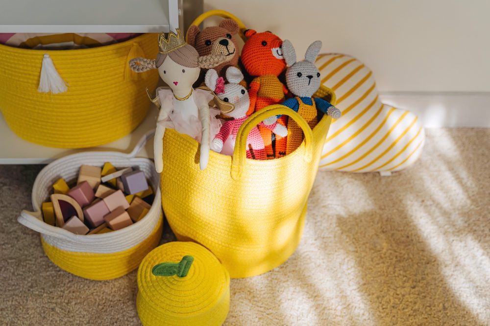 Cleaning a child's room - toys in a toy basket