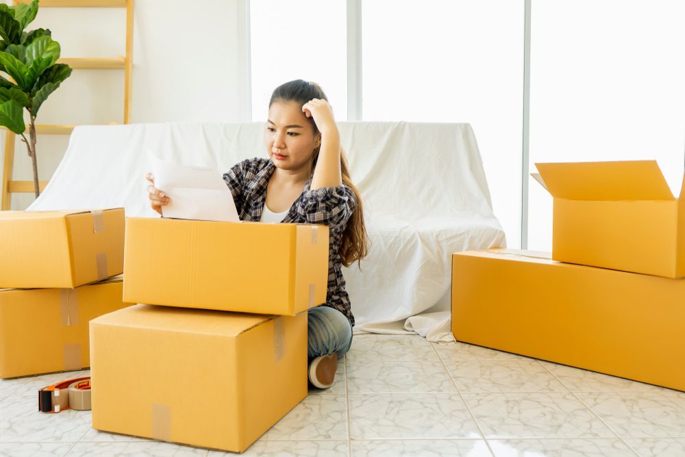 Woman Attempting to Clean Her Home While Moving Out