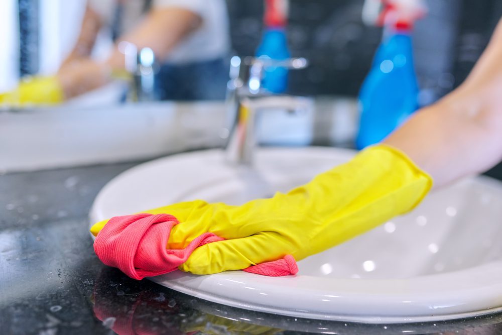 Woman Cleaning Bathroom Wrong