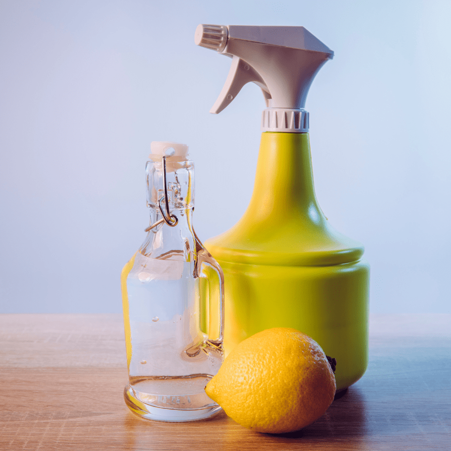 Vinegar cleaner homeade with a lemon in a clean kitchen