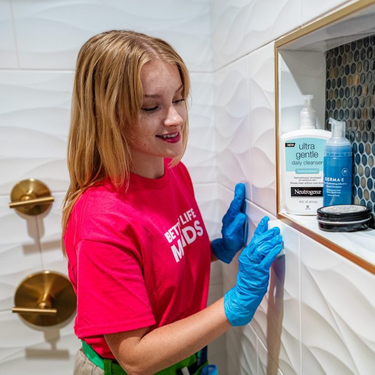 Better Life Maids House Cleaning Chesterfield MO - Team member cleaning a shower enclosure in a Chesterfield House Cleaning visit